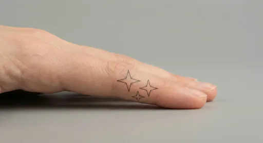 fine line stars tattoo on the finger