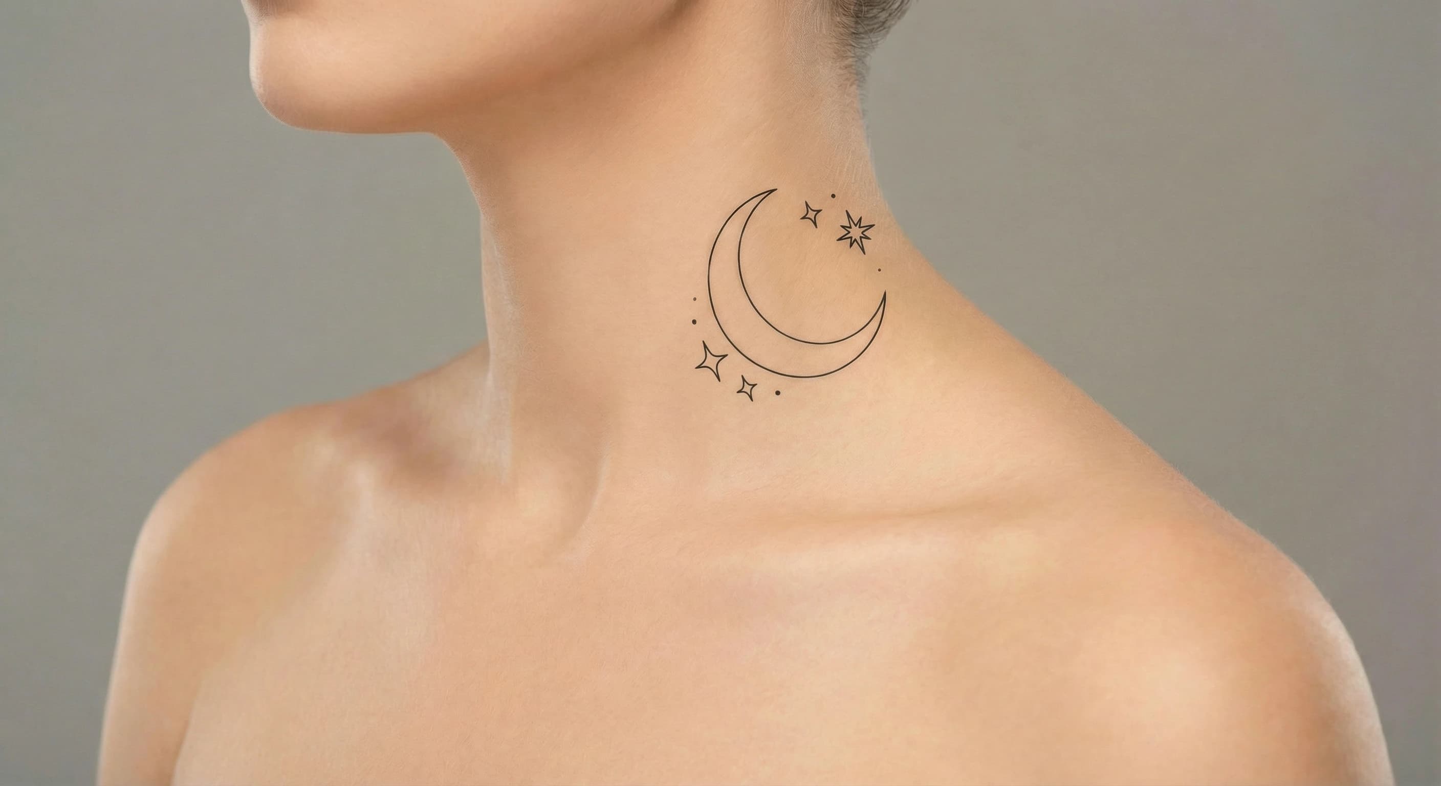 fine line moon tattoo on the neck